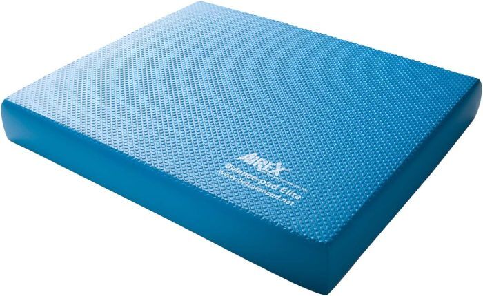 Blue balance pad with textured surface for stability training and rehabilitation exercises.